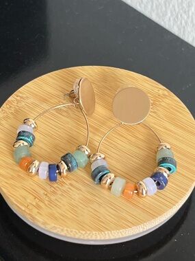 Plunder Gold tone hoop earrings multicolor beads.